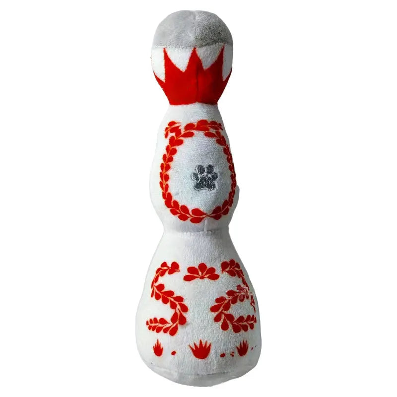 Red and white plush dog toy shaped like a tequila bottle with squeaker