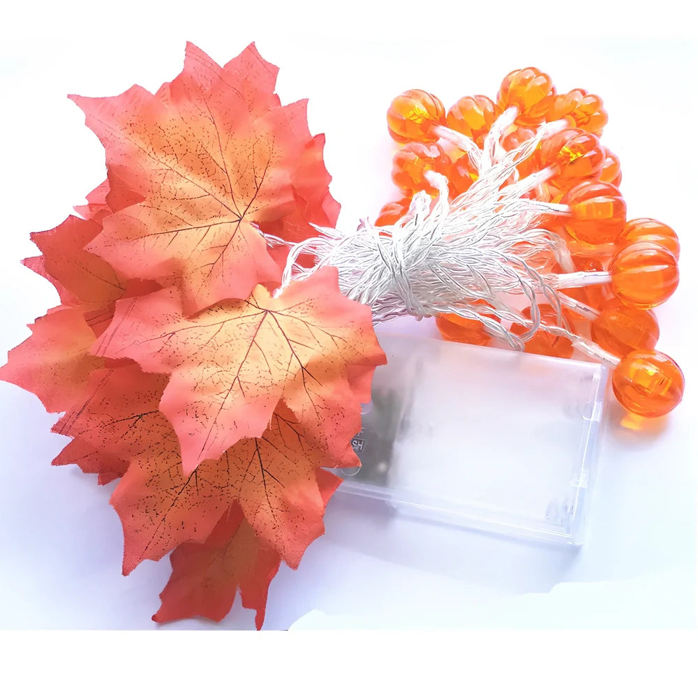 Halloween pumpkin light string with orange plastic pumpkins and warm white LED illumination
