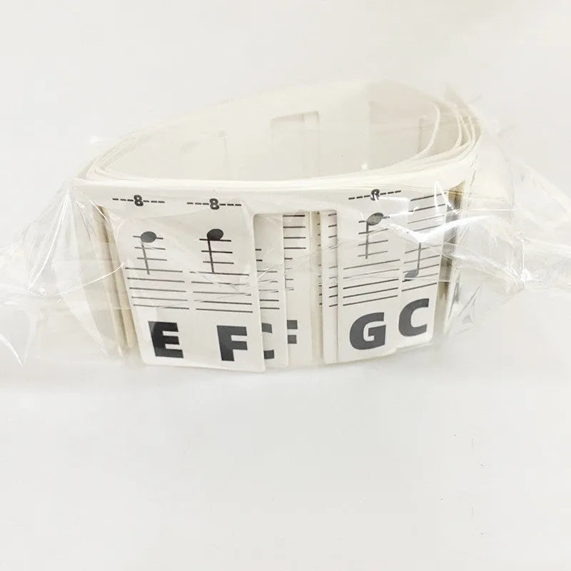Piano keyboard stickers for 88-key pianos showing white card staff notation with colour bars and black notes