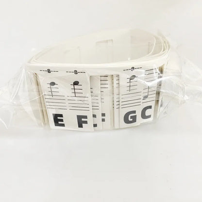 Piano keyboard stickers for 88-key pianos showing white card staff notation with colour bars and black notes