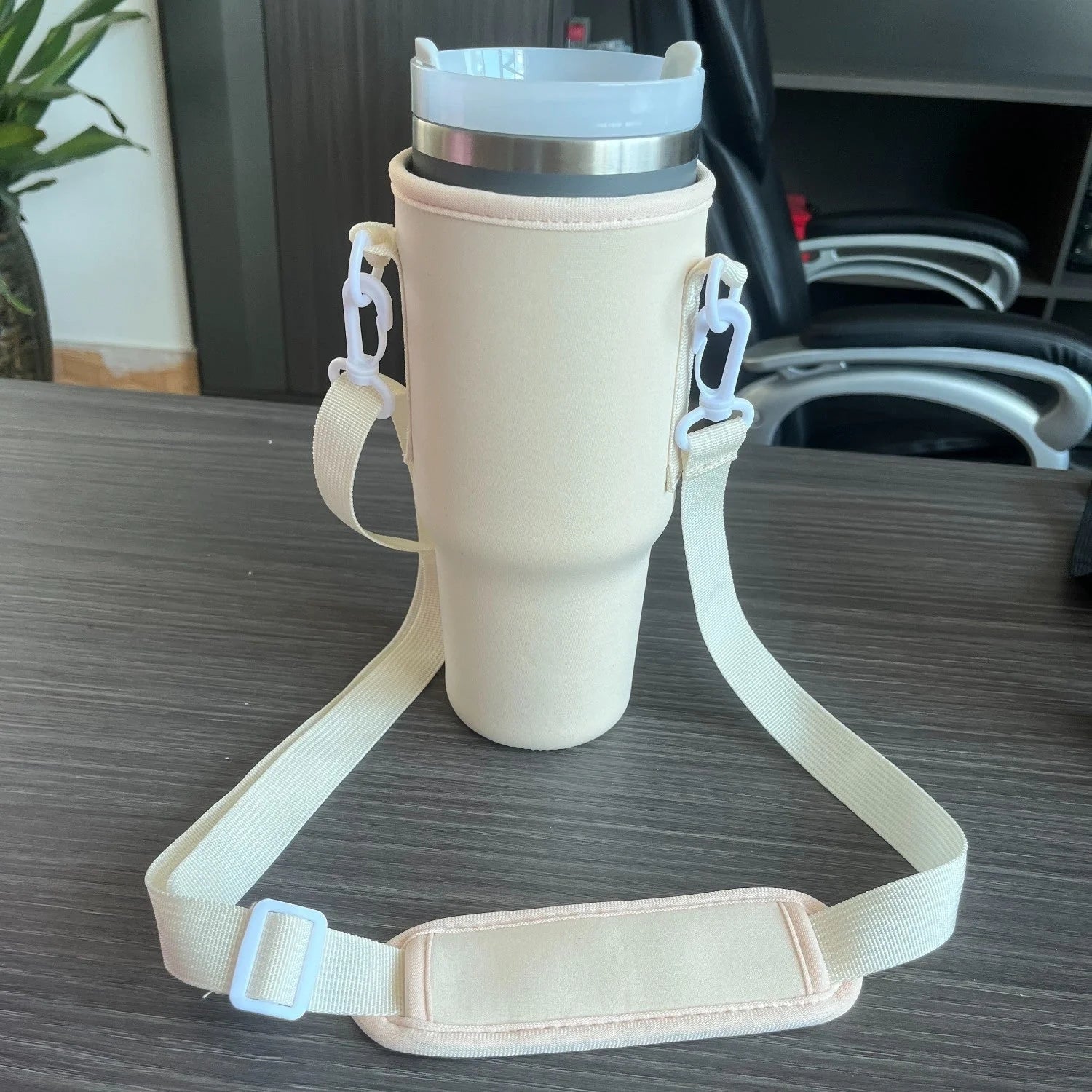 Portable insulated beverage cup cover made of durable cloth material in black, pink, and apricot colors for outdoor use