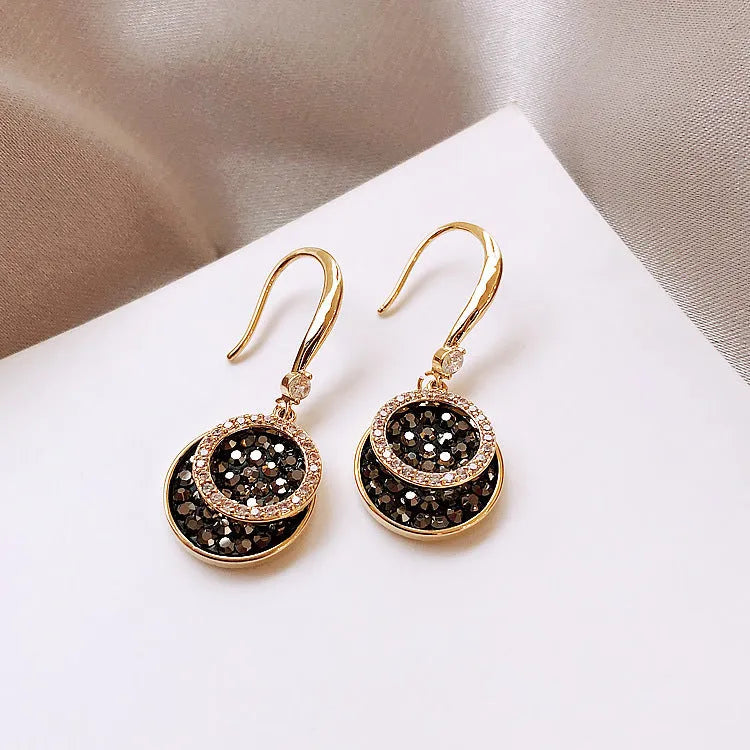 Black retro geometric circle drop earrings with hook fastening, 3.6cm long.