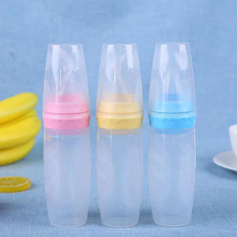 Blue silicone baby feeding spoon with squeeze mechanism, 19.5cm length