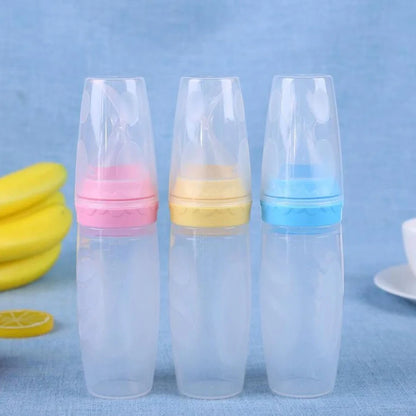 Blue silicone baby feeding spoon with squeeze mechanism, 19.5cm length