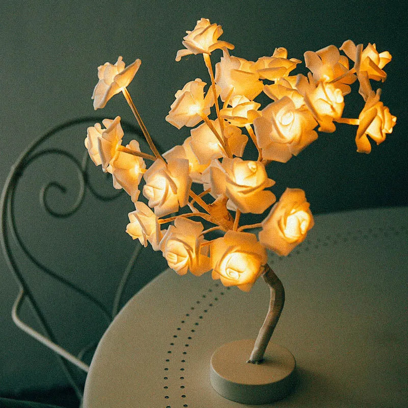 White and red rose flower LED lamp on a bonsai tree stand with warm white lights.