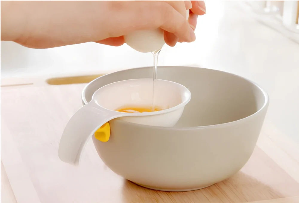 White ABS plastic egg separator with 10cm handle and 7.3cm bowl for yolk separation