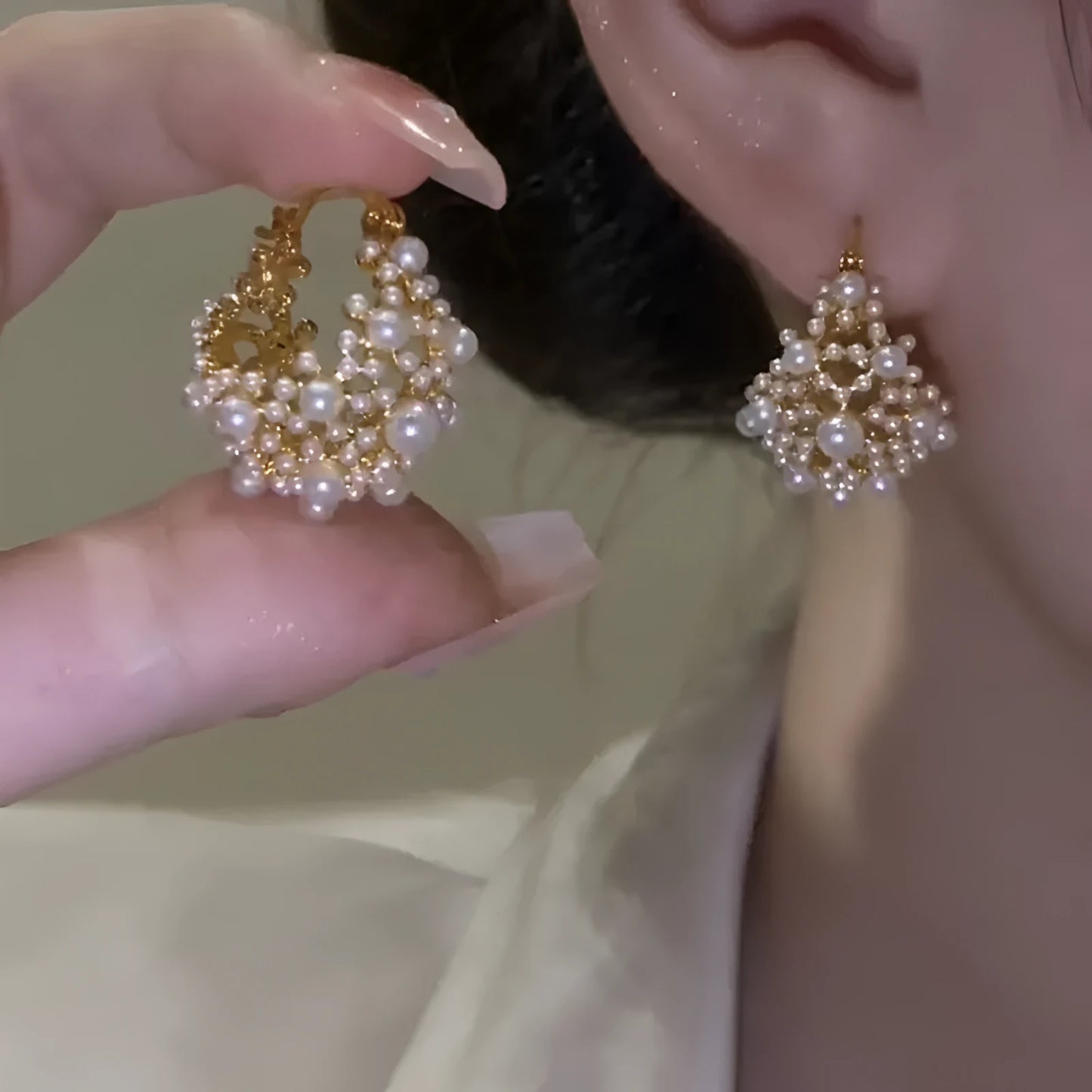 Gold-colour copper flower basket earrings with small rice-shaped bead inlay detail.