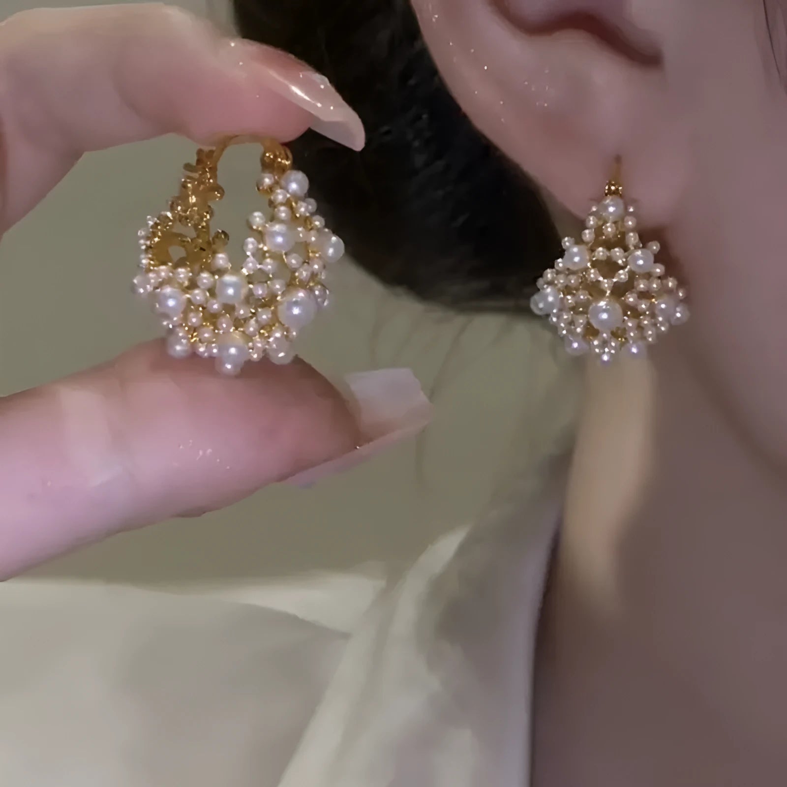 Gold-colour copper flower basket earrings with small rice-shaped bead inlay detail.