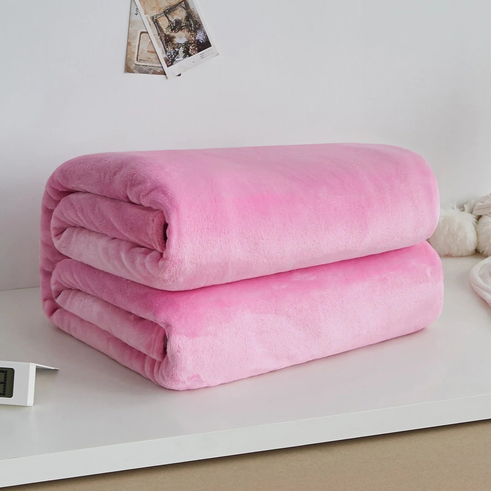 Coral fleece flannel blanket in beige showing textured surface and consistent edges