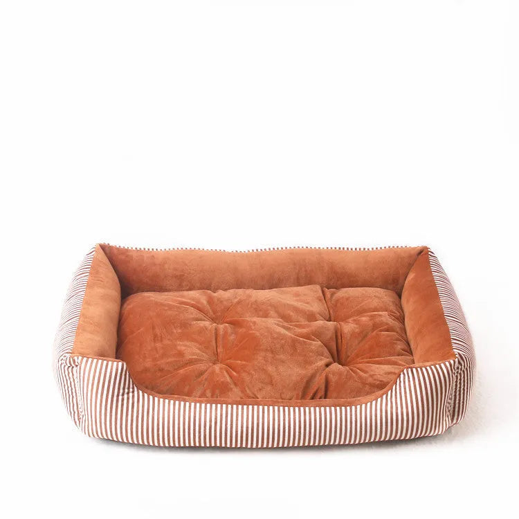 Oval cloth pet bed for dogs or cats in a striped colour pattern, showing its soft cushion shape.