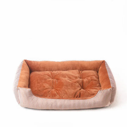 Oval cloth pet bed for dogs or cats in a striped colour pattern, showing its soft cushion shape.