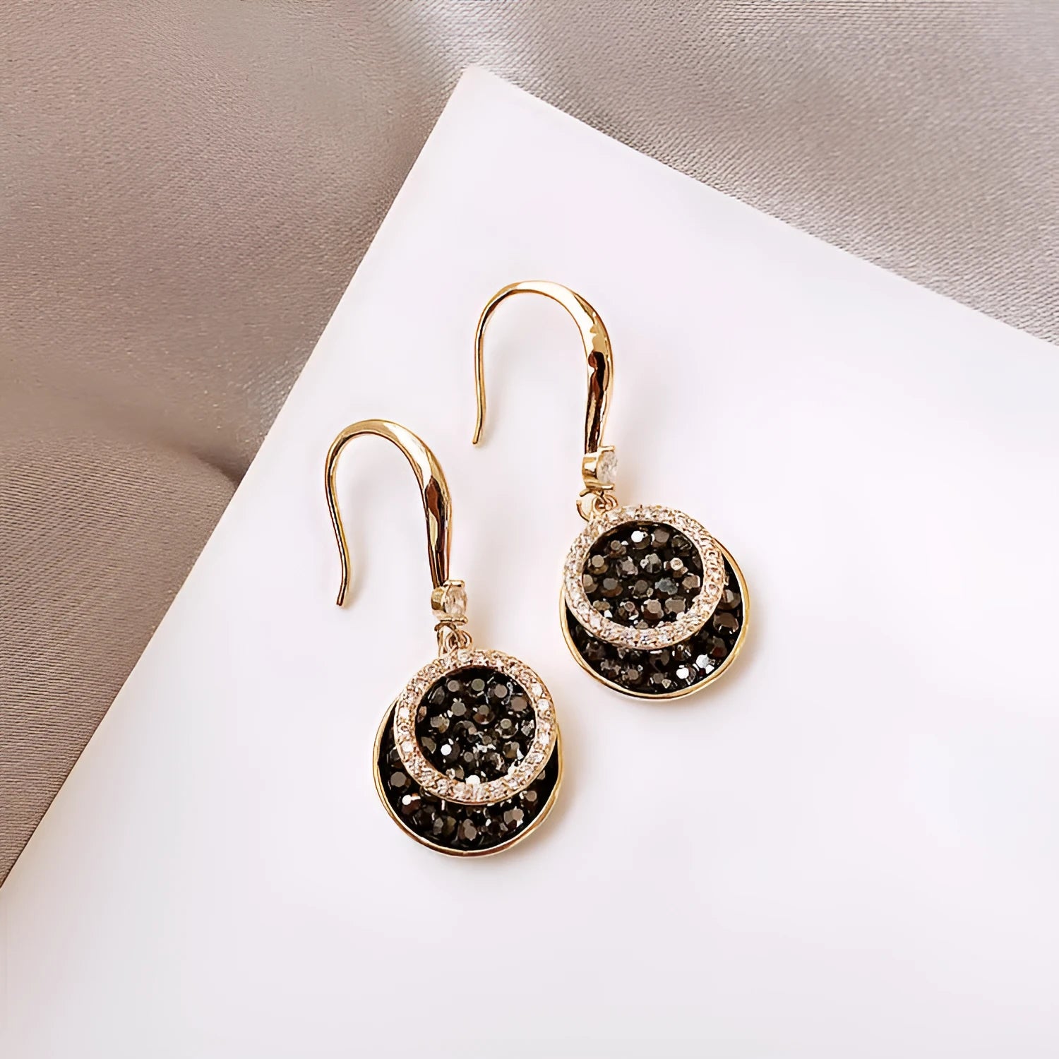 Black retro geometric circle drop earrings with hook fastening, 3.6cm long.