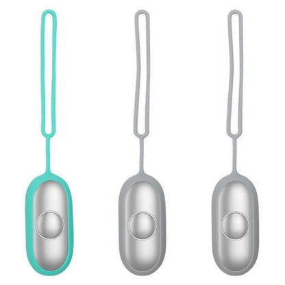 Hand-held micro-current sleep aid device in grey, green, and orange colour options