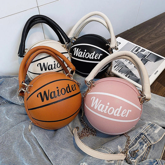 Basketball-shaped handbag with adjustable shoulder strap in pink, white, black, and brown