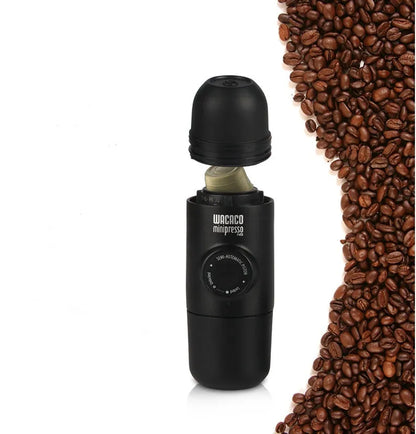 Black portable manual coffee machine with pressure gauge, 6cm wide and 17.5cm tall.