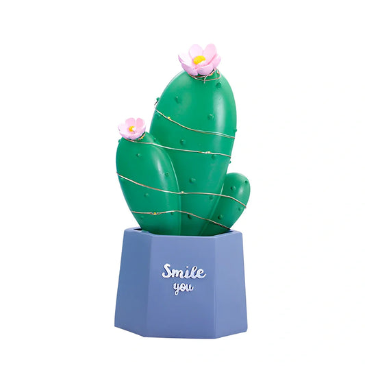 Cactus-shaped resin night light in gold finish measuring 15cm tall with warm LED glow
