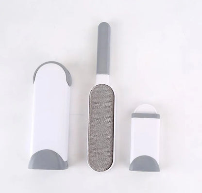 Blue reusable pet hair removal comb with sticky brush and self-cleaning base for sofas.