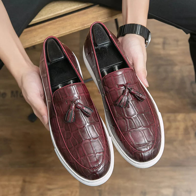 Men's business casual sneakers in black and wine red with leather-like finish and decorative tassels