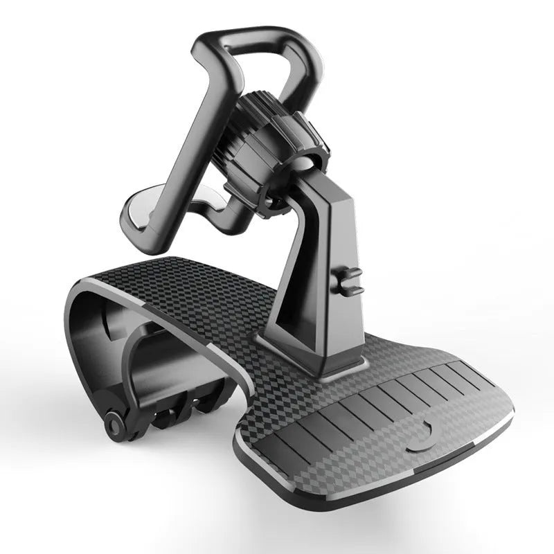 Black universal car phone holder with 360-degree rotating head on a car dashboard.