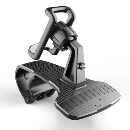 Black universal car phone holder with 360-degree rotating head on a car dashboard.