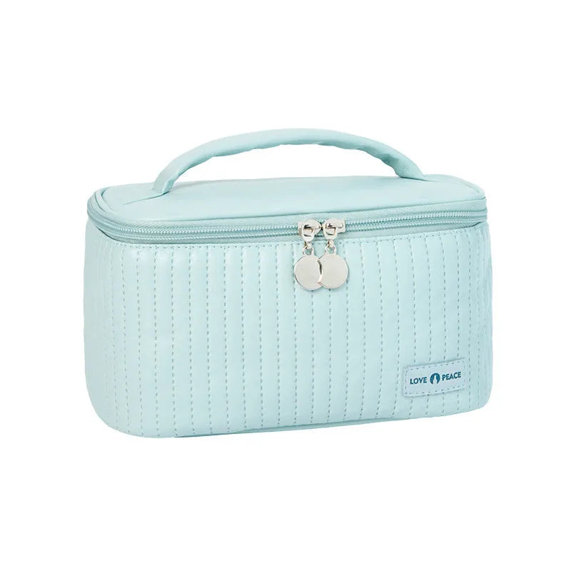 Open-top cake makeup bag in six colour options with PU leather construction and 20cm dimensions