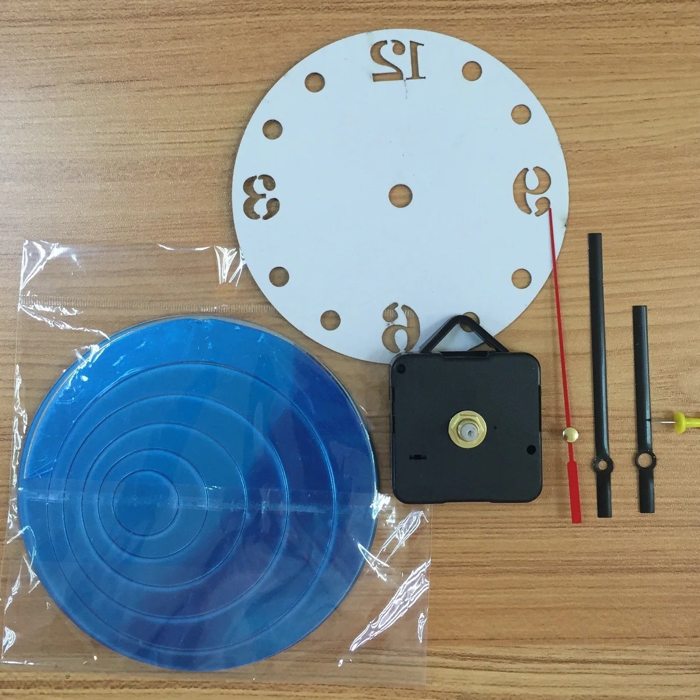 30cm round wall clock with black frame and white face showing Arabic numerals