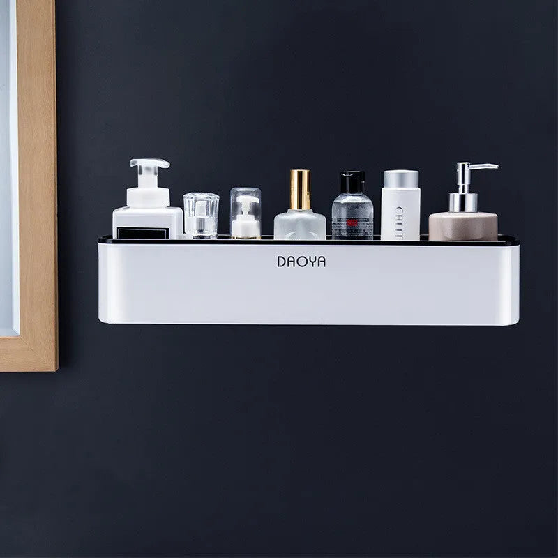 Plastic bathroom wall shelf with hole-free installation in a grey finish, holding shampoo and shower gel bottles.