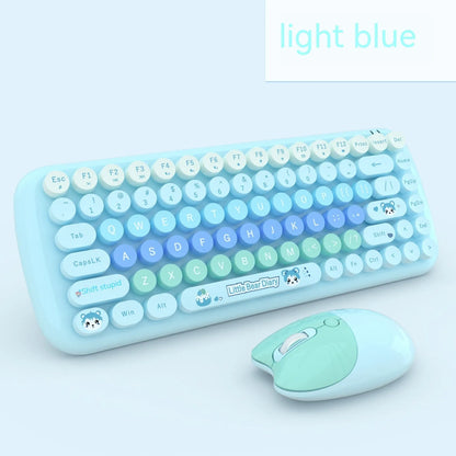 Pink mini wireless keyboard and mouse set with cute cartoon design on desk