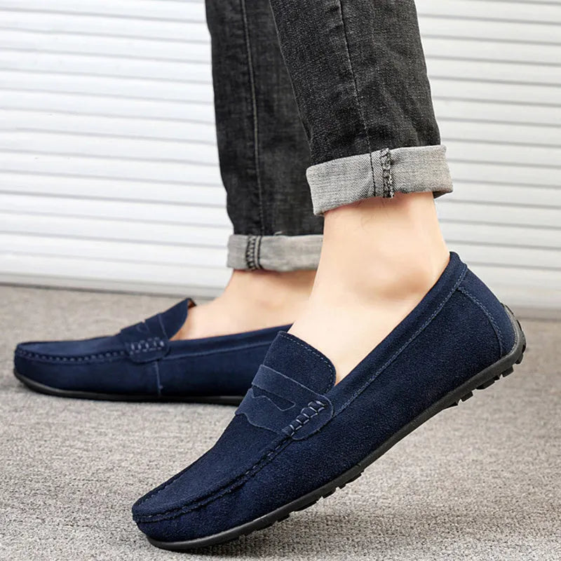 Men's suede loafers in black, blue, dark blue, wine red, and yellow colours with round toe and slip-on design.