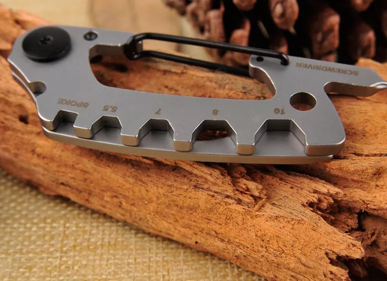 Stainless steel multi-function keychain with geometric gadgets including screwdrivers and hex wrenches