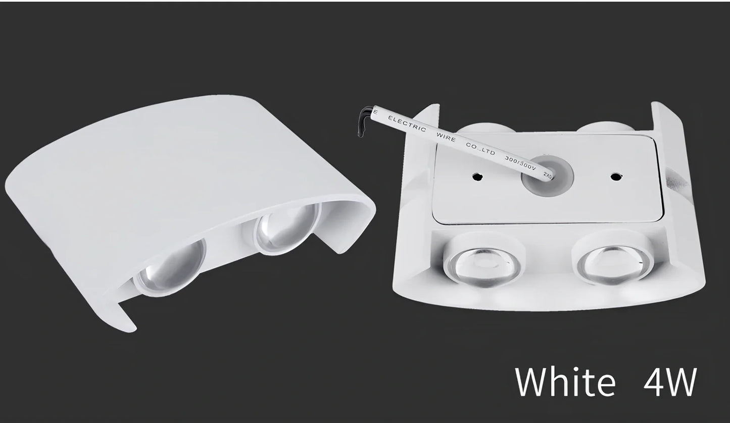 Waterproof black aluminium LED wall lamp 4W warm white emitting 60-degree beam angle mounted on white wall