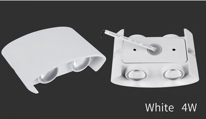 Waterproof black aluminium LED wall lamp 4W warm white emitting 60-degree beam angle mounted on white wall