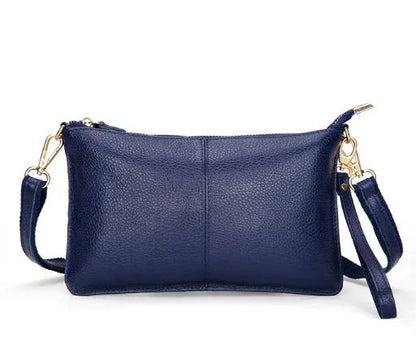 Lady's cowhide slant bag in apricot colour showing front view with strap and compact 24 cm size.