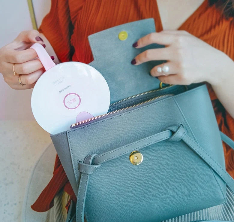 Compact USB-powered baby bottle sterilizer in blue and pink options