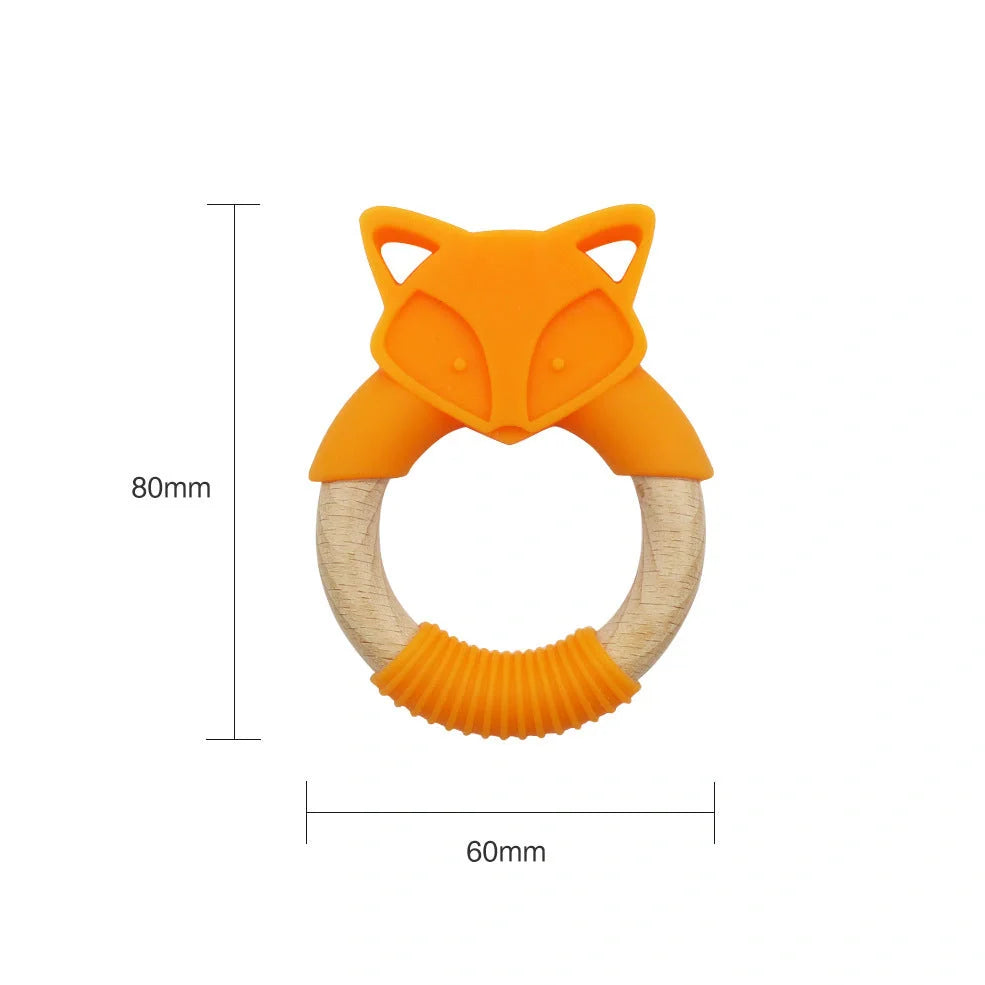 Wooden fox teether with orange silicone ring measuring 80mm high