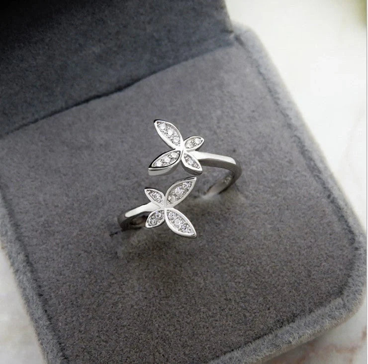 Adjustable sterling silver ring with intricate butterfly design, ideal for everyday wear or special occasions.