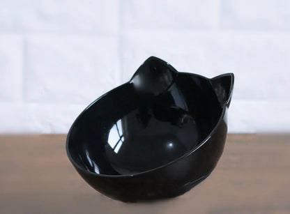 An inclined cat food bowl with a transparent design and a sturdy base, providing a comfortable and hygienic dining experience for your feline friend.