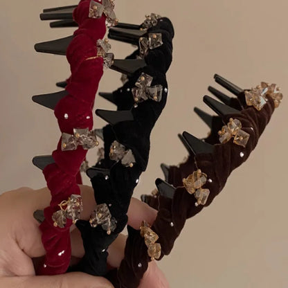Velvet and crystal embellished high-head hairband in a choice of colours on a white background.