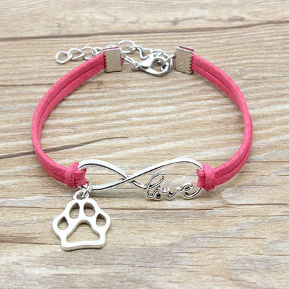 Hand-woven Infinite Love Pet Bracelet in various colors, showcasing the bow shape and alloy material.
