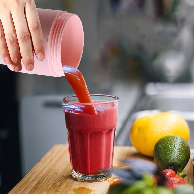 Blue portable mini blender with USB charging cable and measuring 450ml capacity