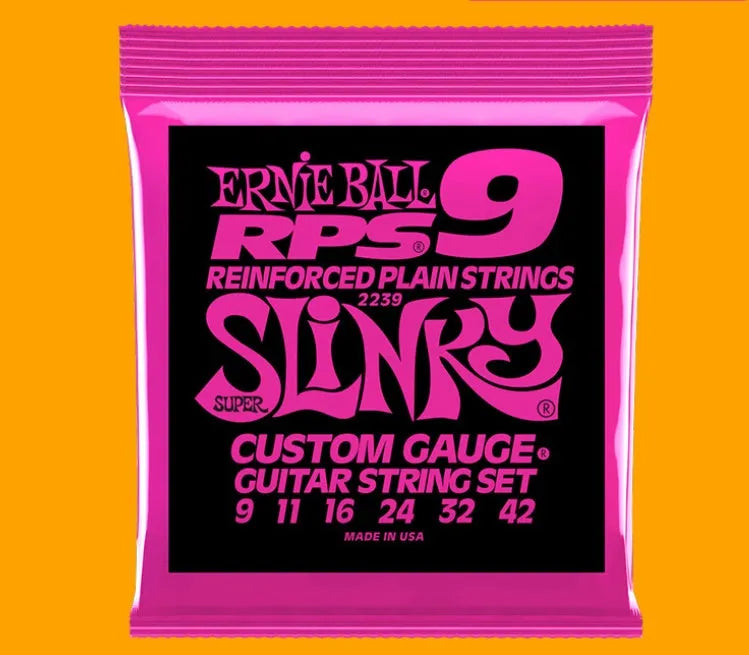 Coils of nickel-plated electric guitar strings and bass strings showing their metallic shine.