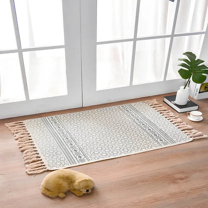 Hand-woven Scandinavian style linen cotton rug with woven tassels in plant-dyed colours measuring 60x90cm
