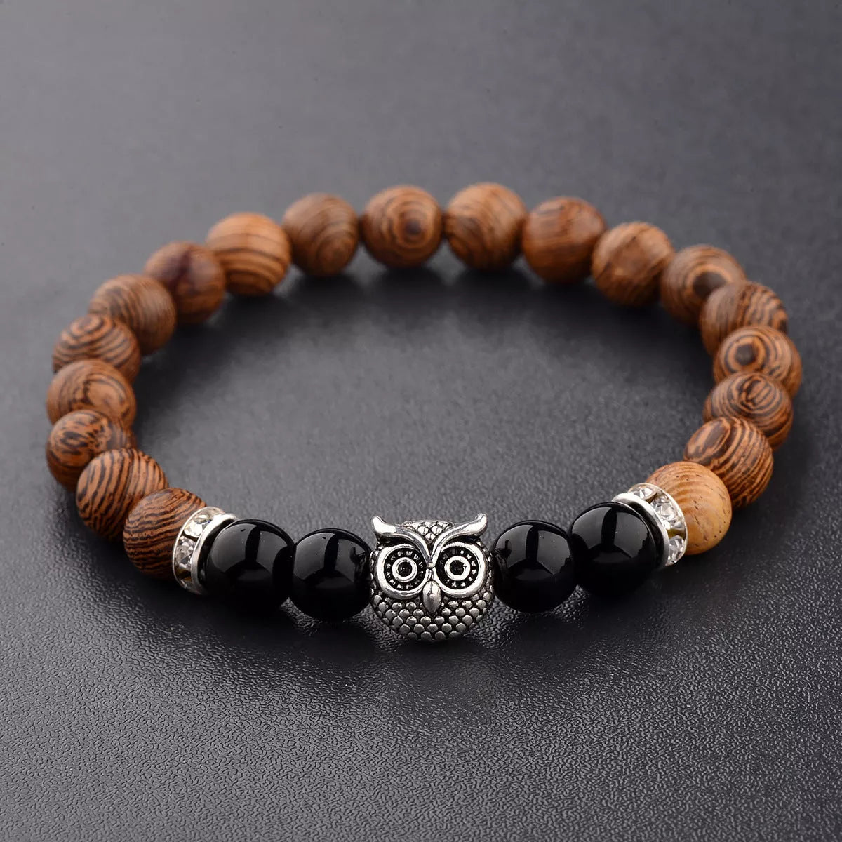 Owl frosted stone lifeline wood grain bracelet in black and gold, featuring wood beads and alloy stone