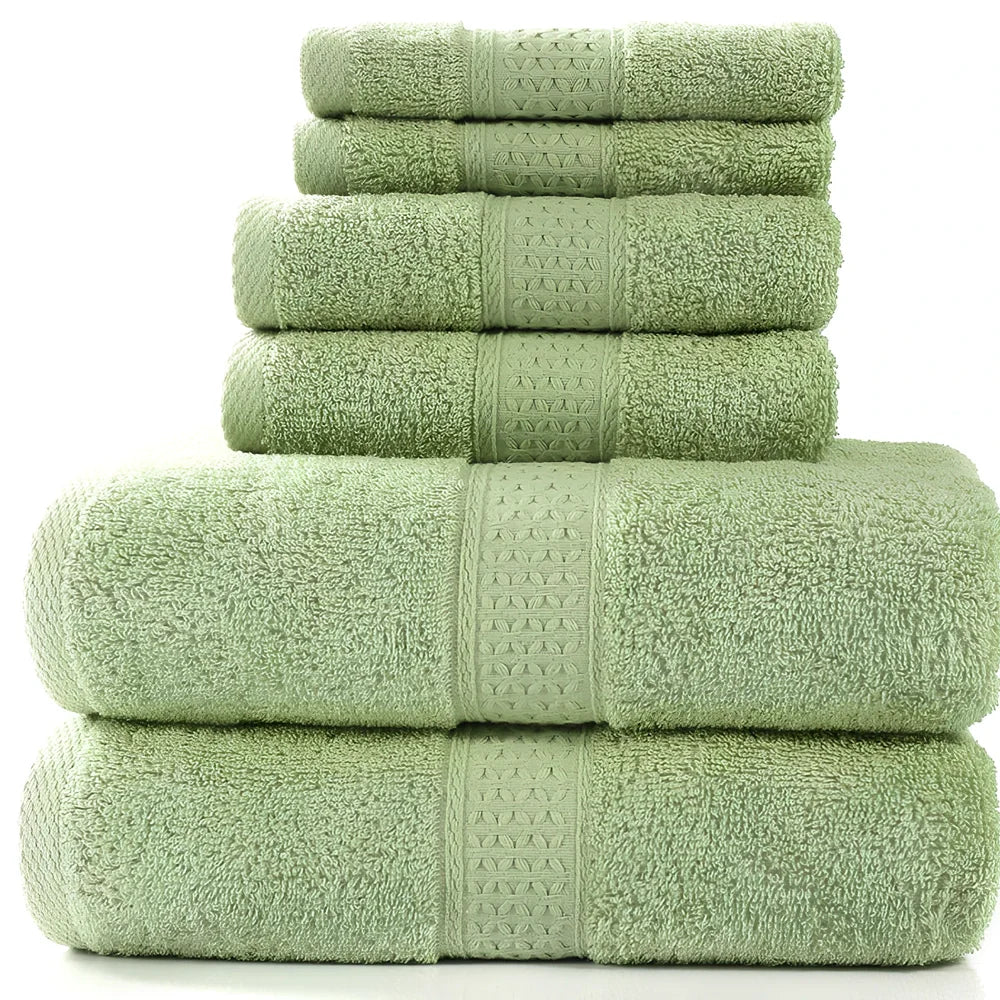 Cotton towel set showing bath towel, hand towel, and face cloth in coordinated sizes