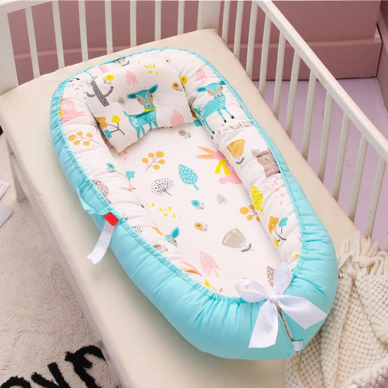 Portable cotton crib bed folded and unfolded showing 97x46cm dimensions and Banana leaf pattern