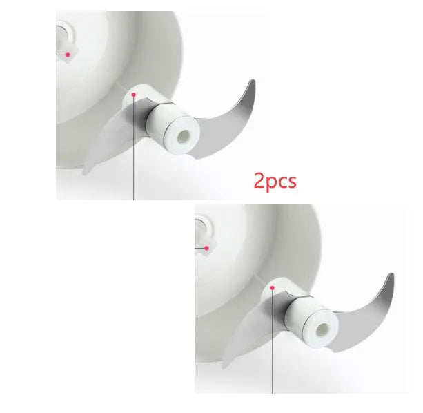 White manual food chopper with stainless steel blades on a kitchen countertop.