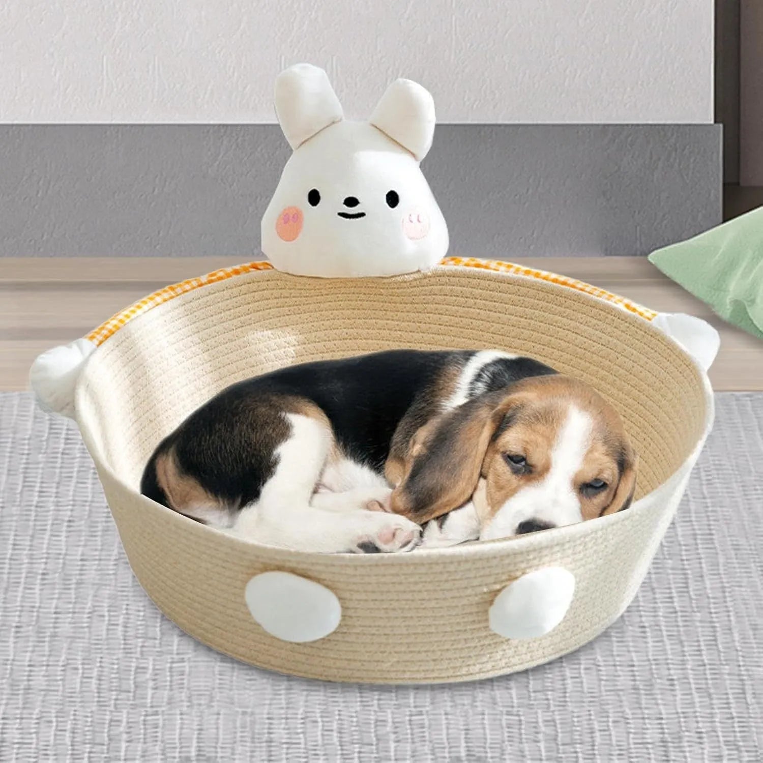 Woven cotton rope basket serving as a pet bed and integrated scratch board for cats, shown in a beige colour.