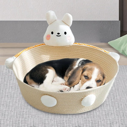 Woven cotton rope basket serving as a pet bed and integrated scratch board for cats, shown in a beige colour.