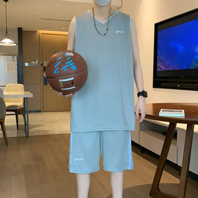 Men's thin polyester basketball sports suit consisting of a sleeveless vest and short pants on a hanger.