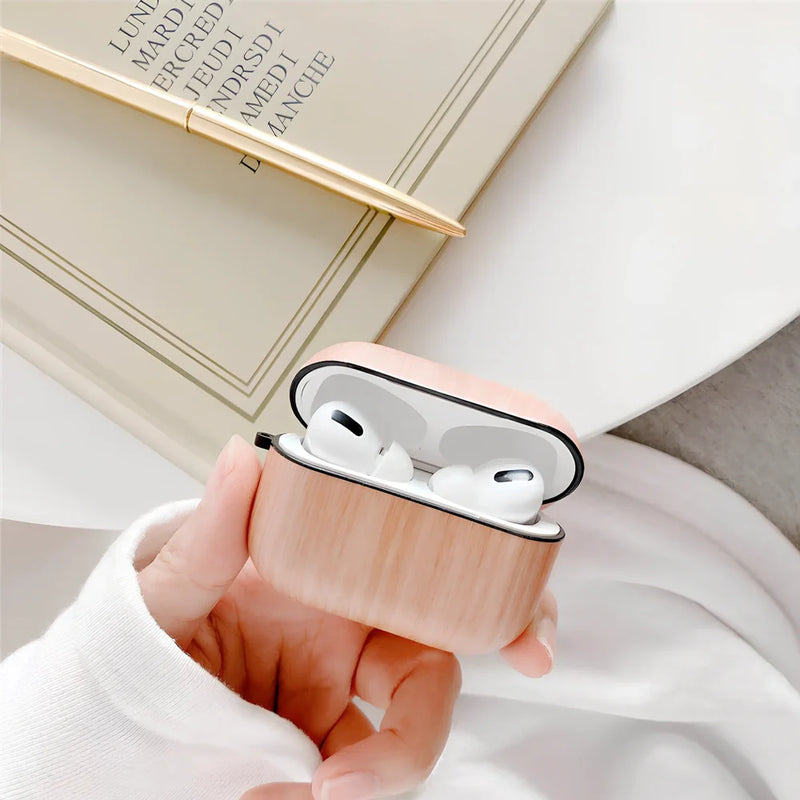 Wood grain AirPods Pro Bluetooth case featuring IMD clamshell design with six natural wood finish options including dark brown and red brown patterns for enhanced grip and scratch resistance